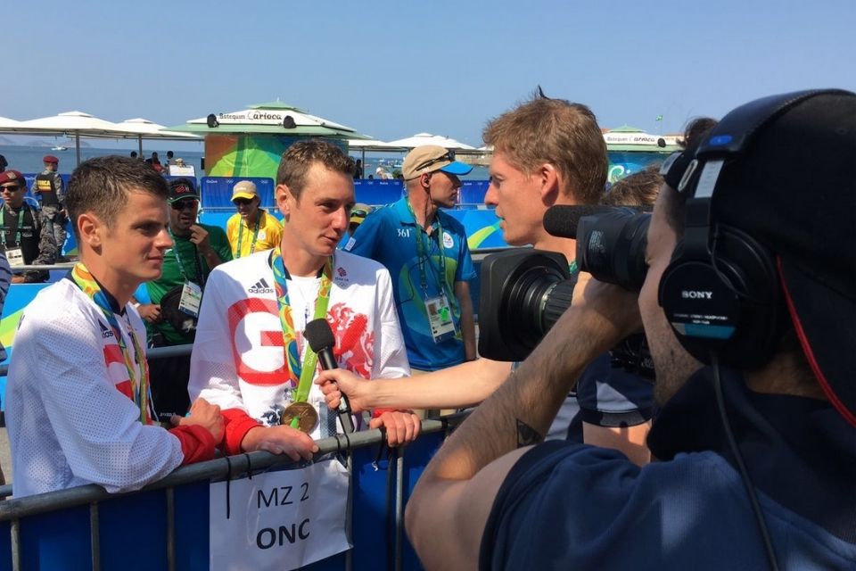 BBC Radio Presenter interviewing two athletes